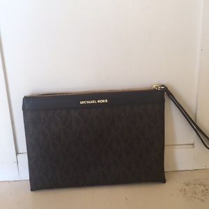 Micheal Kors extra large wristlet.